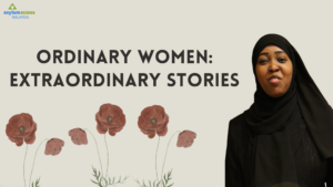 Ordinary Women: Extraordinary Stories. Poppies and the photo of Ridwan, a Somali woman wearing a dark hijab.