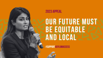 2023 Appeal. Our Future must be equitable and local. Deepa speaking intp a microphone.